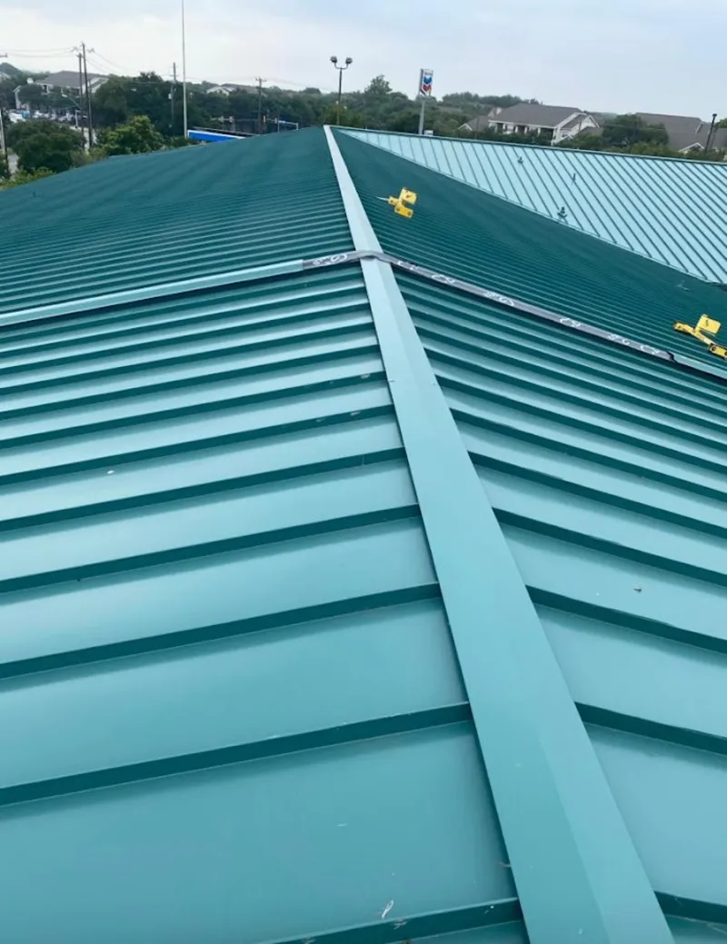 Green commercial metal roof ridge and valley for Metal Roof Repair in Ferndale